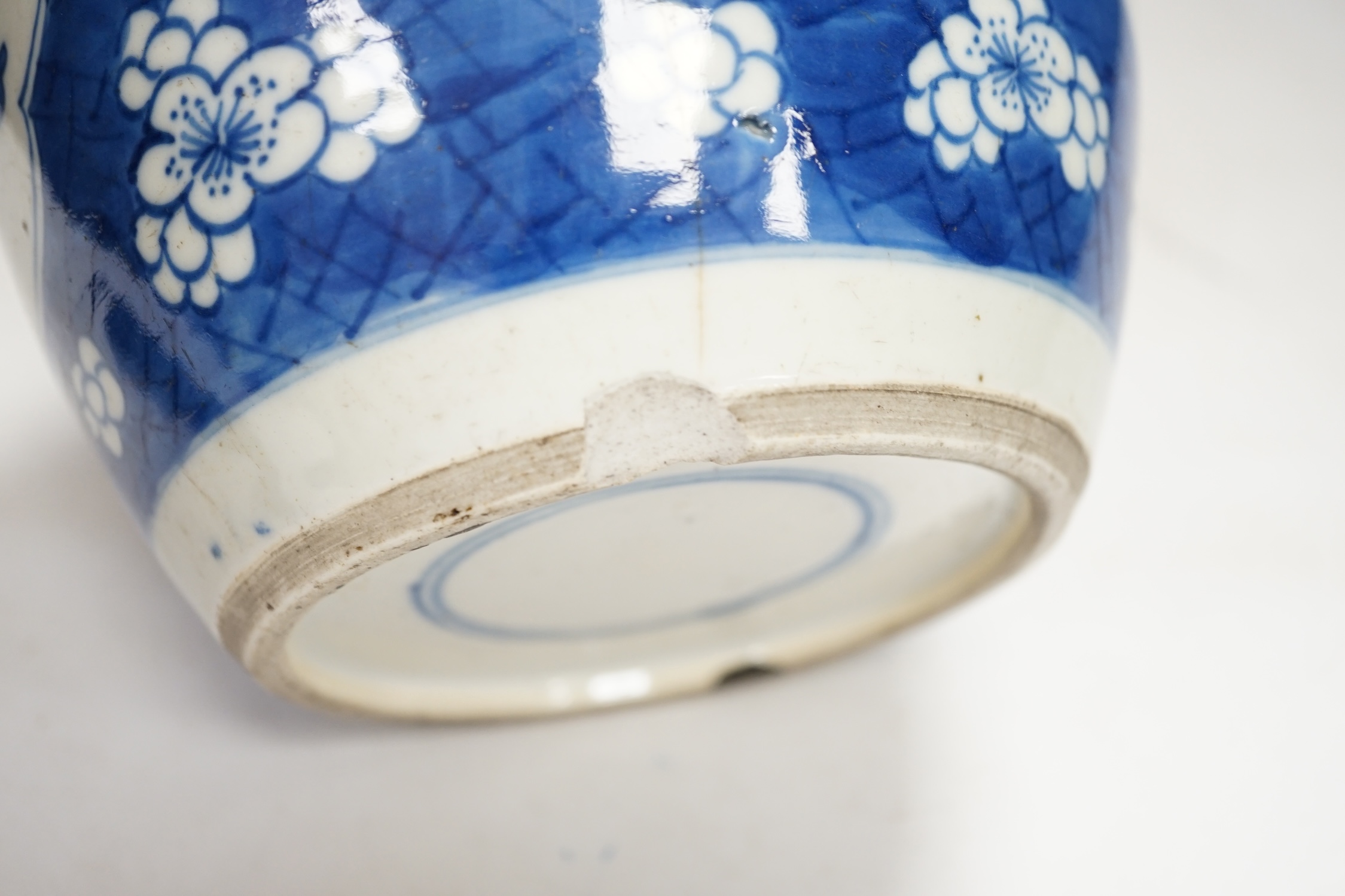 A Chinese Kangxi blue and white jar and a similar vase, jar 19.5cm high. Condition - both cracked and chipped, poor